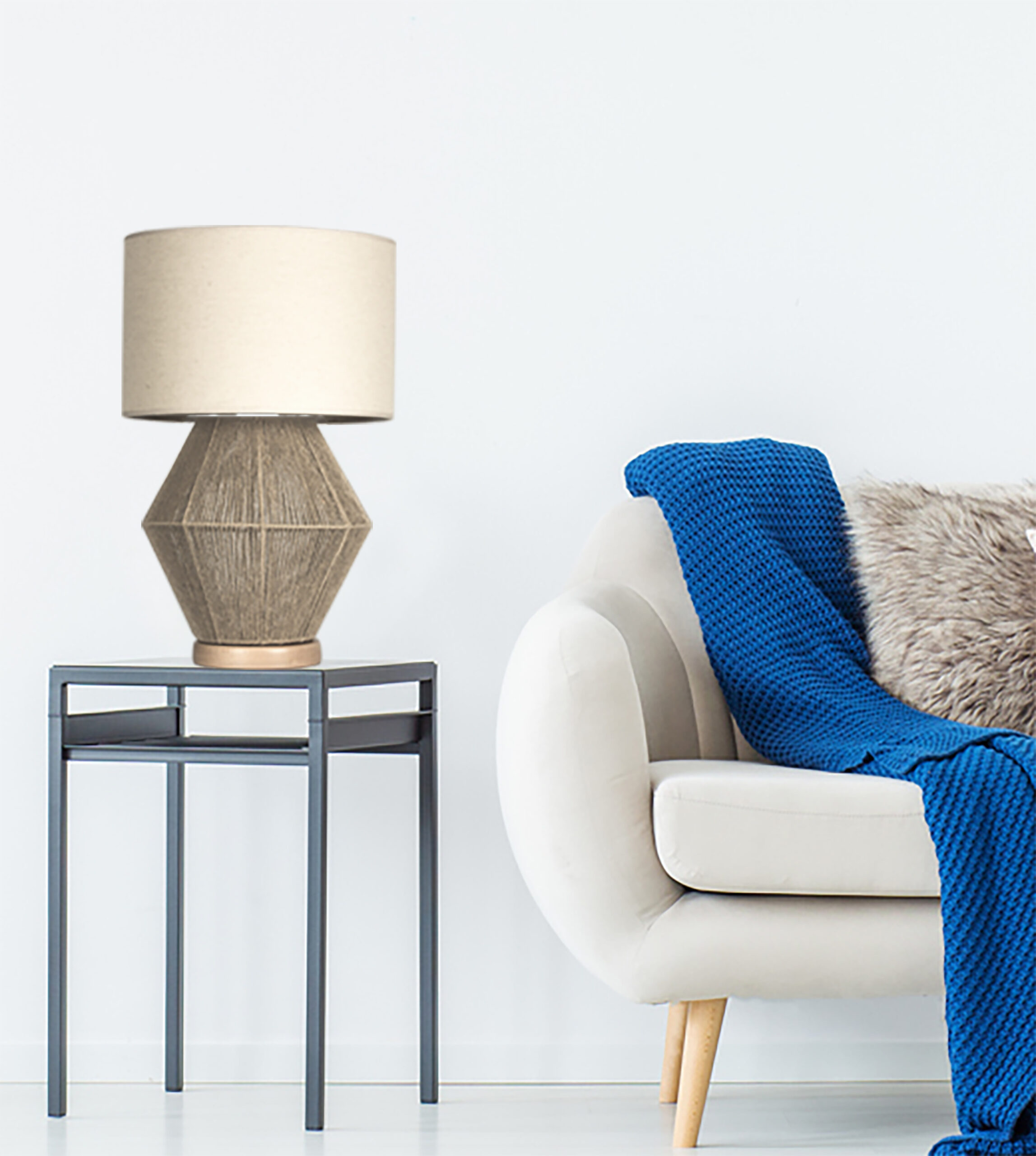 Blue blanket on beige sofa